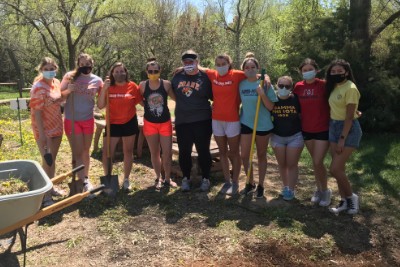 Doane students taking a break from a park cleanup.